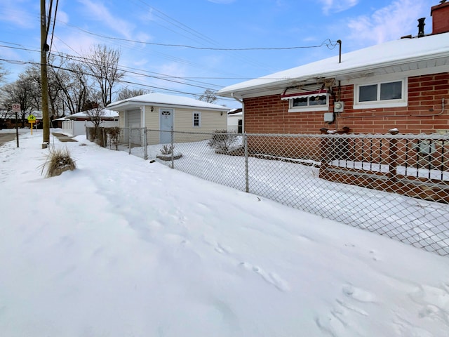 exterior space with fence and brick siding