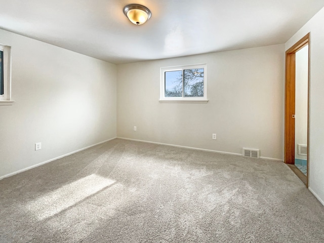 unfurnished bedroom featuring baseboards, visible vents, and carpet flooring