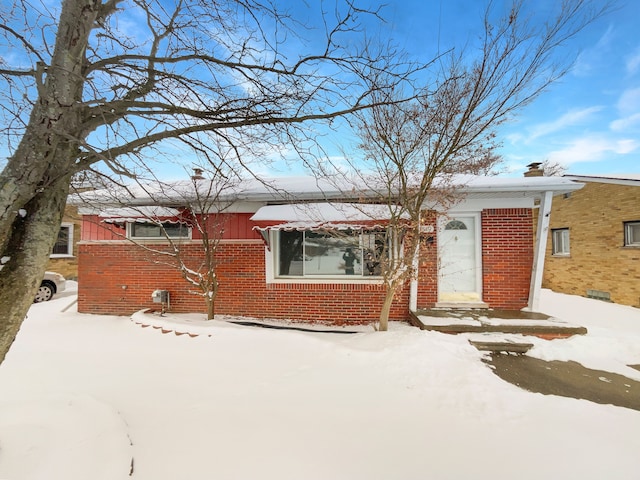 single story home with brick siding