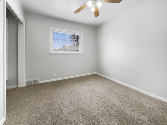 unfurnished bedroom featuring ceiling fan, carpet flooring, visible vents, and baseboards