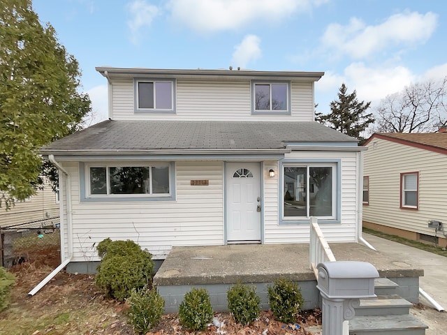 view of front of property featuring roof with shingles