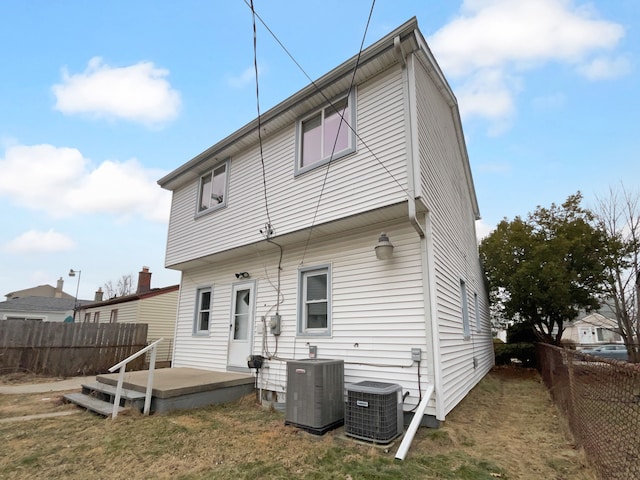 back of house featuring a patio area, a fenced backyard, and central AC unit