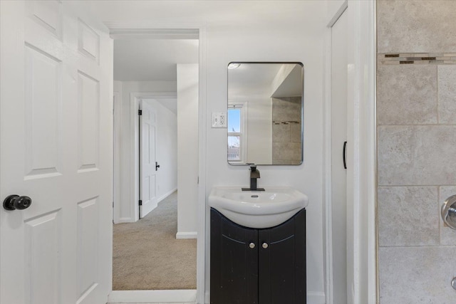 bathroom featuring baseboards and vanity