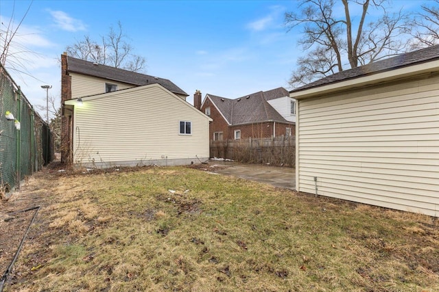 view of yard with a patio and a fenced backyard