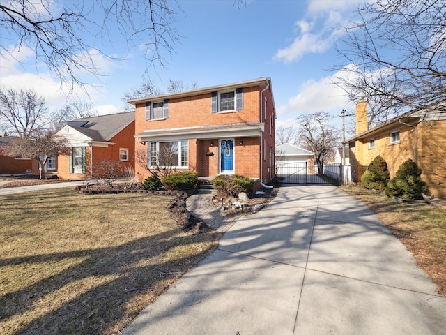 traditional home with a detached garage, a gate, fence, a front lawn, and brick siding