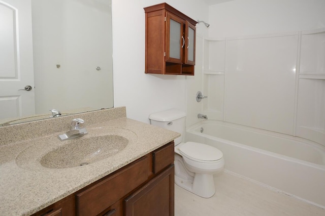 bathroom with toilet, shower / bathtub combination, and vanity