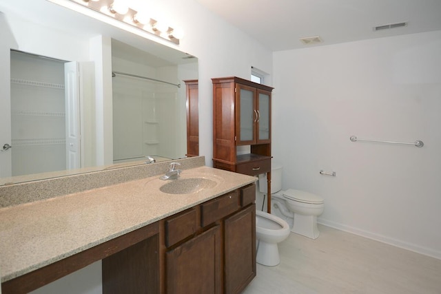 full bath featuring toilet, a shower, a bidet, and visible vents