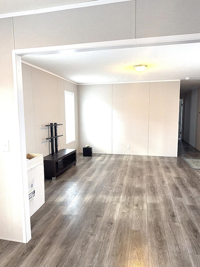 unfurnished living room with wood finished floors