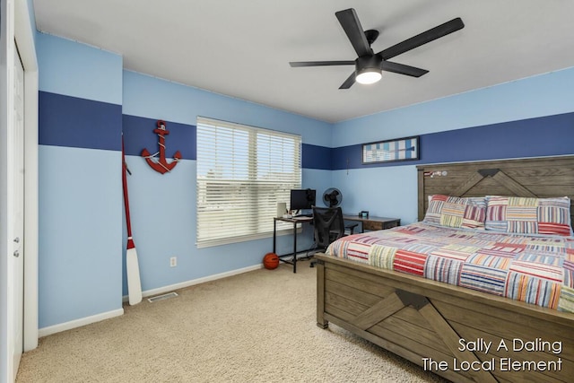 carpeted bedroom featuring a ceiling fan, visible vents, and baseboards