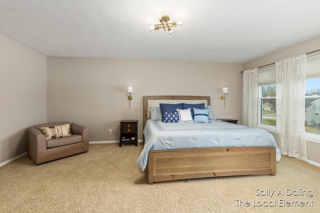 carpeted bedroom with baseboards