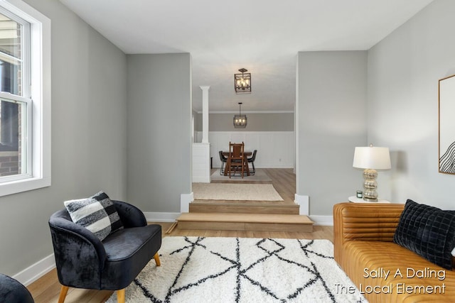 living room featuring wood finished floors and baseboards