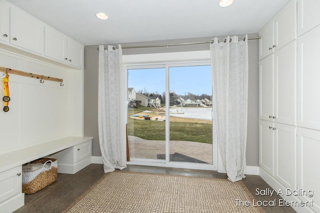 mudroom with baseboards and recessed lighting