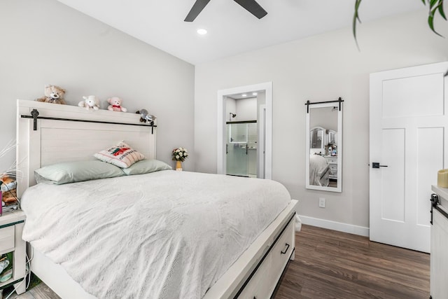 bedroom featuring a barn door, recessed lighting, a ceiling fan, baseboards, and dark wood-style floors