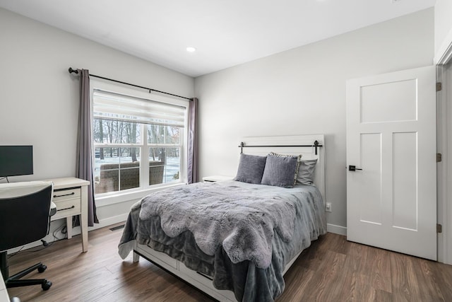 bedroom with recessed lighting, wood finished floors, visible vents, and baseboards