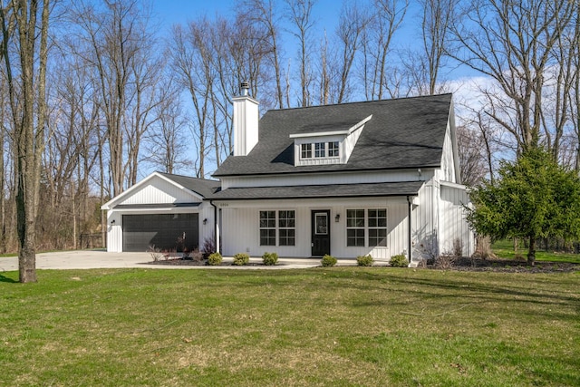 view of front of house with a chimney, a front lawn, concrete driveway, an attached garage, and roof with shingles