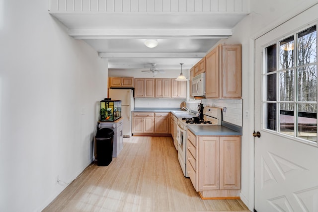 kitchen featuring white appliances, light brown cabinets, decorative backsplash, and beam ceiling