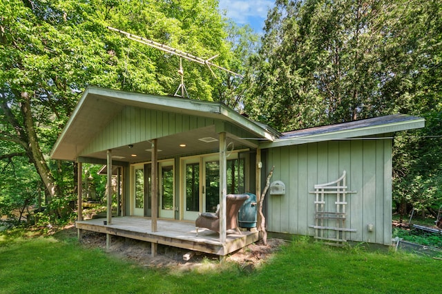 rear view of house with a lawn