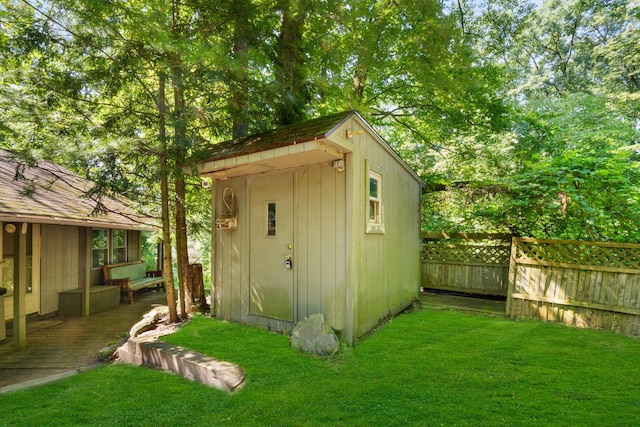 view of shed with fence