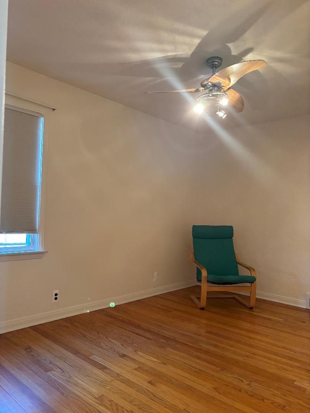 unfurnished room with light wood-style flooring, baseboards, and ceiling fan