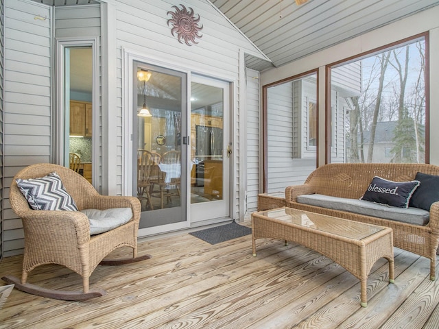 sunroom / solarium with vaulted ceiling