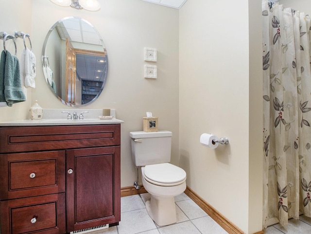 full bath featuring toilet, vanity, a shower with curtain, baseboards, and tile patterned floors