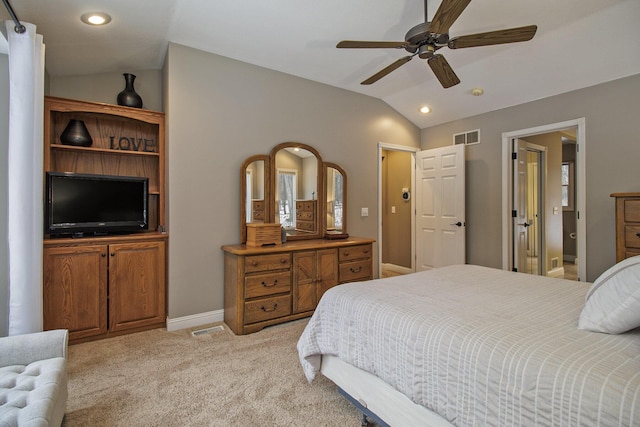 bedroom featuring lofted ceiling, ceiling fan, light carpet, visible vents, and baseboards