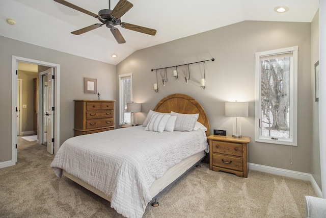 bedroom featuring carpet floors, lofted ceiling, and baseboards