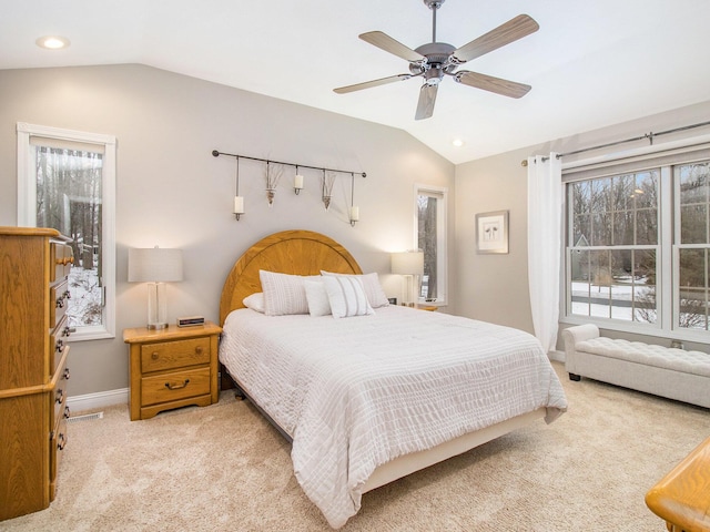 bedroom with lofted ceiling, light colored carpet, baseboards, and recessed lighting