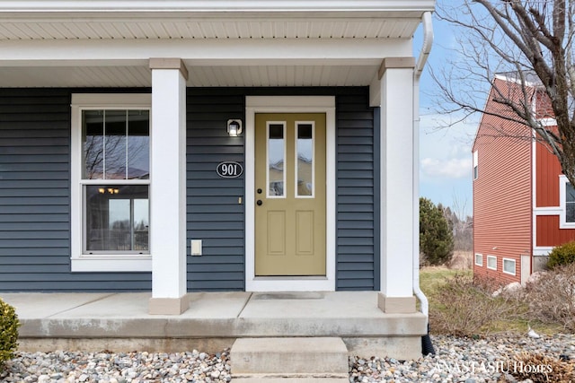 property entrance featuring a porch