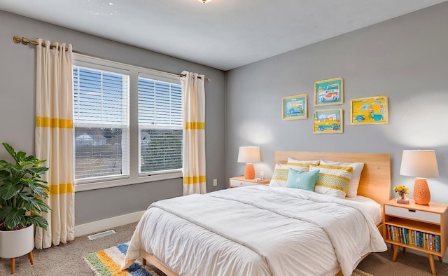 bedroom featuring carpet flooring, visible vents, and baseboards