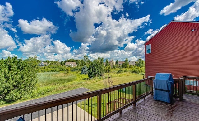 deck with a yard and a grill