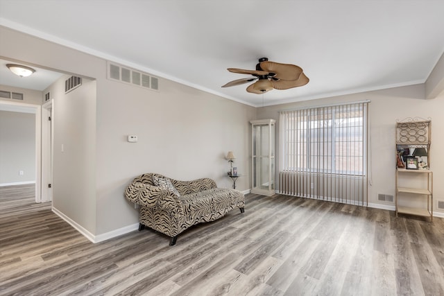 living area with wood finished floors and visible vents