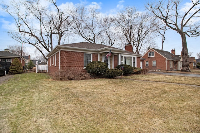 view of front facade featuring brick siding, a chimney, and a front lawn