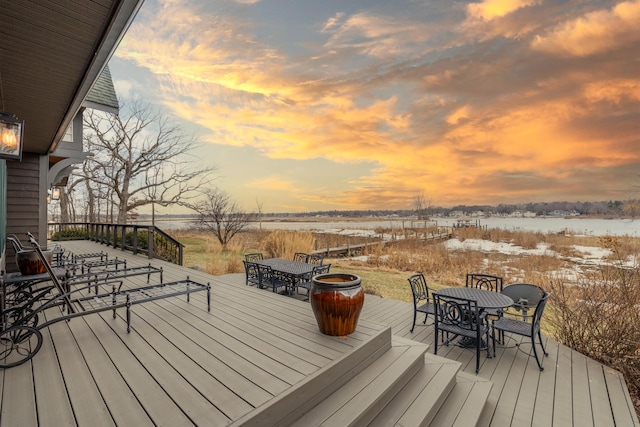 wooden terrace with outdoor dining space