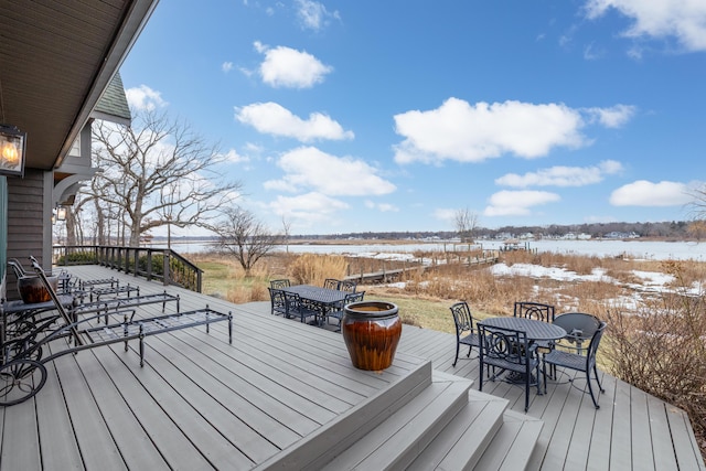 snow covered deck with outdoor dining area