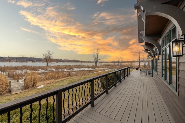 wooden deck with a water view