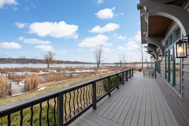 wooden deck featuring a water view