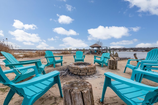 view of patio featuring an outdoor fire pit and a gazebo