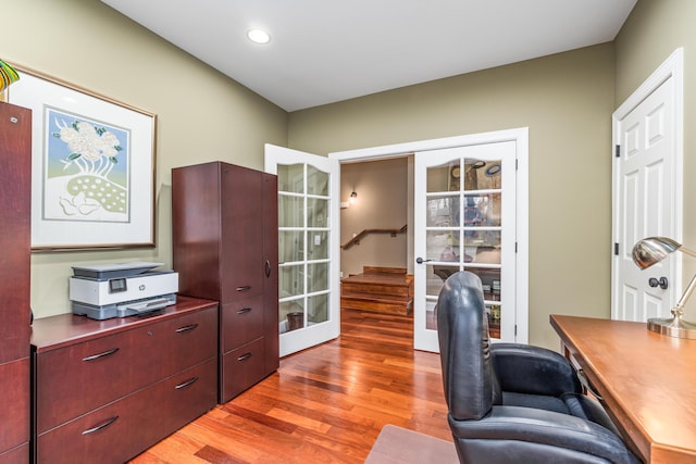 home office with light wood-style floors and recessed lighting