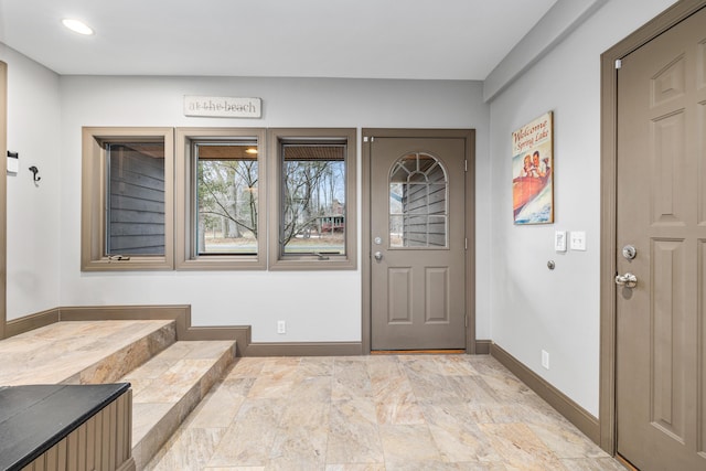 interior space featuring baseboards and recessed lighting