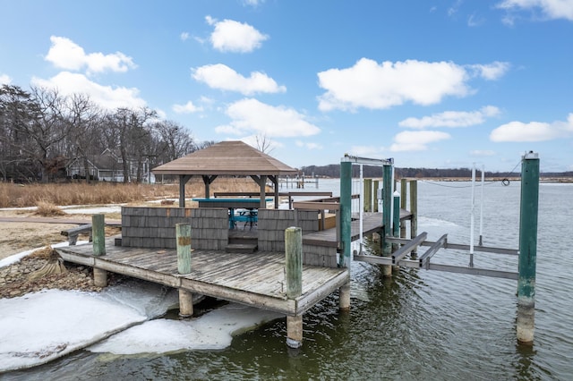 dock area with a water view and boat lift