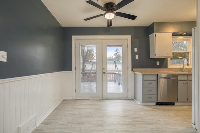 doorway featuring plenty of natural light, french doors, visible vents, and a sink