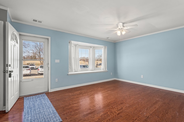 entrance foyer with baseboards, visible vents, a ceiling fan, ornamental molding, and dark wood-type flooring