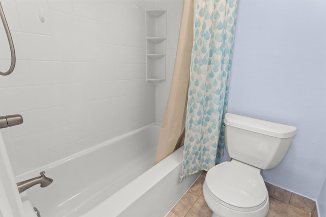 full bath with shower / bath combo with shower curtain, tile patterned flooring, and toilet