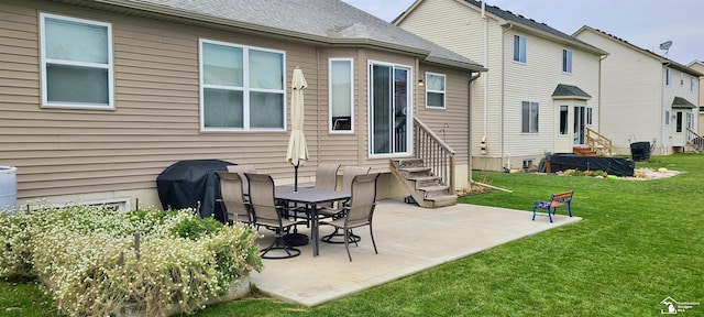 rear view of house with entry steps, a patio, central AC, a lawn, and roof with shingles