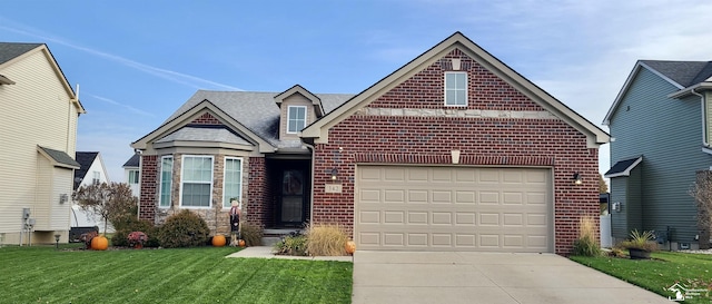 view of front facade featuring an attached garage, concrete driveway, brick siding, and a front yard