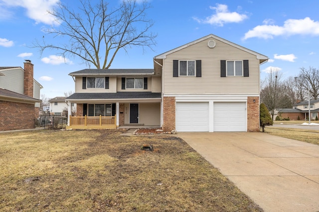 traditional-style home with a garage, concrete driveway, a porch, a front lawn, and brick siding