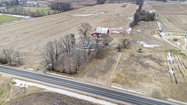 birds eye view of property with a rural view