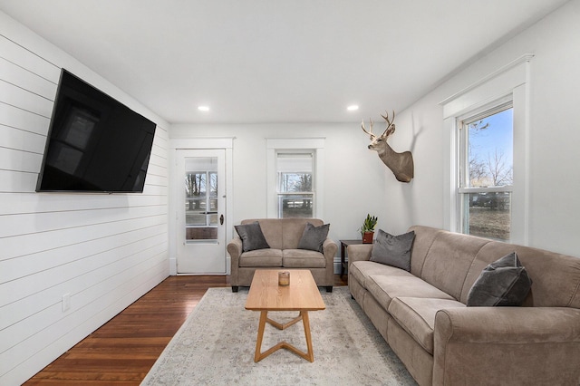 living room featuring a wealth of natural light, recessed lighting, and wood finished floors