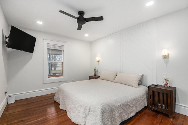 bedroom with a ceiling fan, baseboards, hardwood / wood-style floors, and recessed lighting